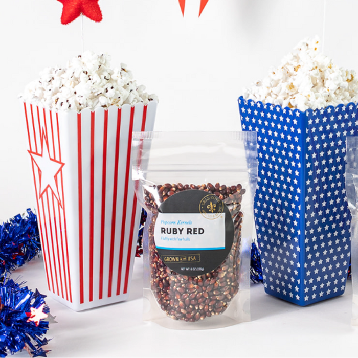 Ruby Red popcorn with popped popcorn in patriotic popcorn boxes - Dell Cove Spices