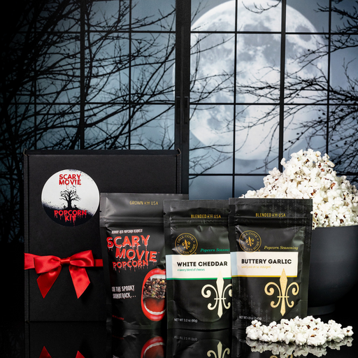 Scary Movie Popcorn Kit with Bloody Red Vampire Popcorn and seasonings on a Halloween party table